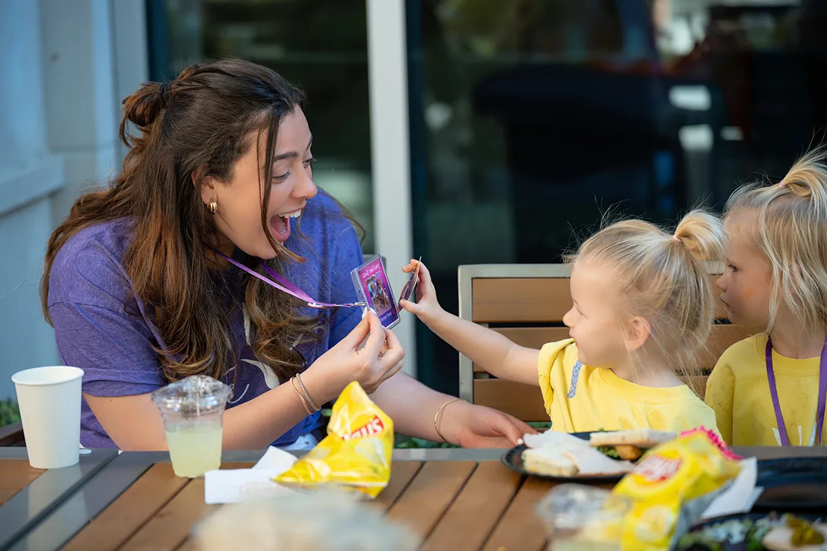 Educator helping children