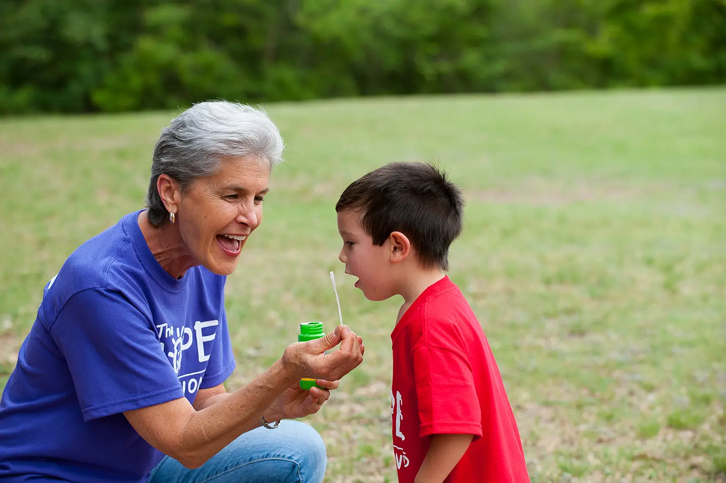 Karyn Purvis with child blowing bubbles